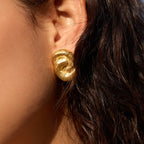 Textured knot stud worn close-up