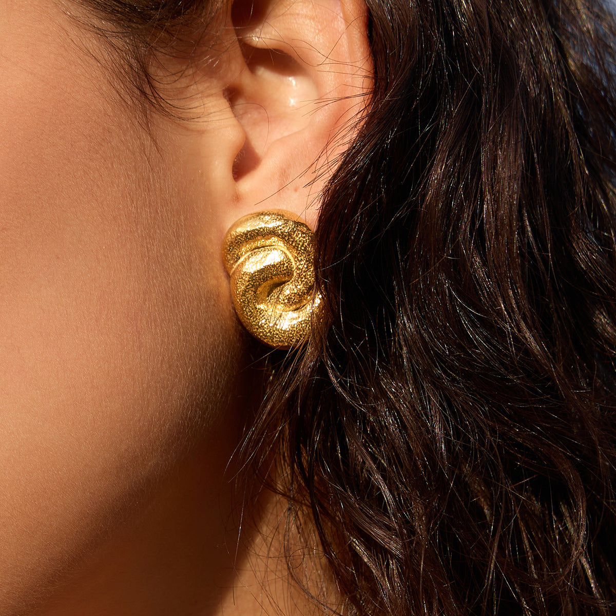 Textured knot stud worn close-up