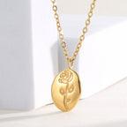 close view of the raised rose engraving on the oval pendant