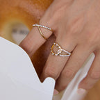 Close-up of crossed bands and stone-trimmed loops