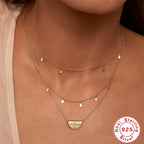 model layering the gold plated teardrop station necklace