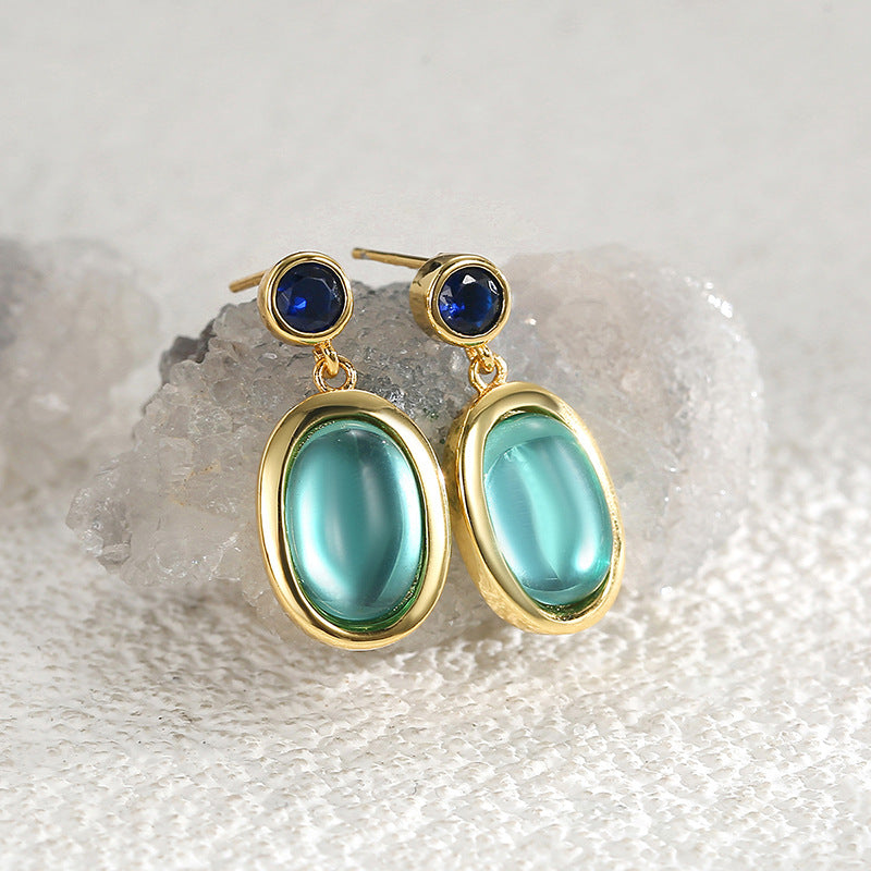 gold plated oval aqua glass and blue stone drop earrings