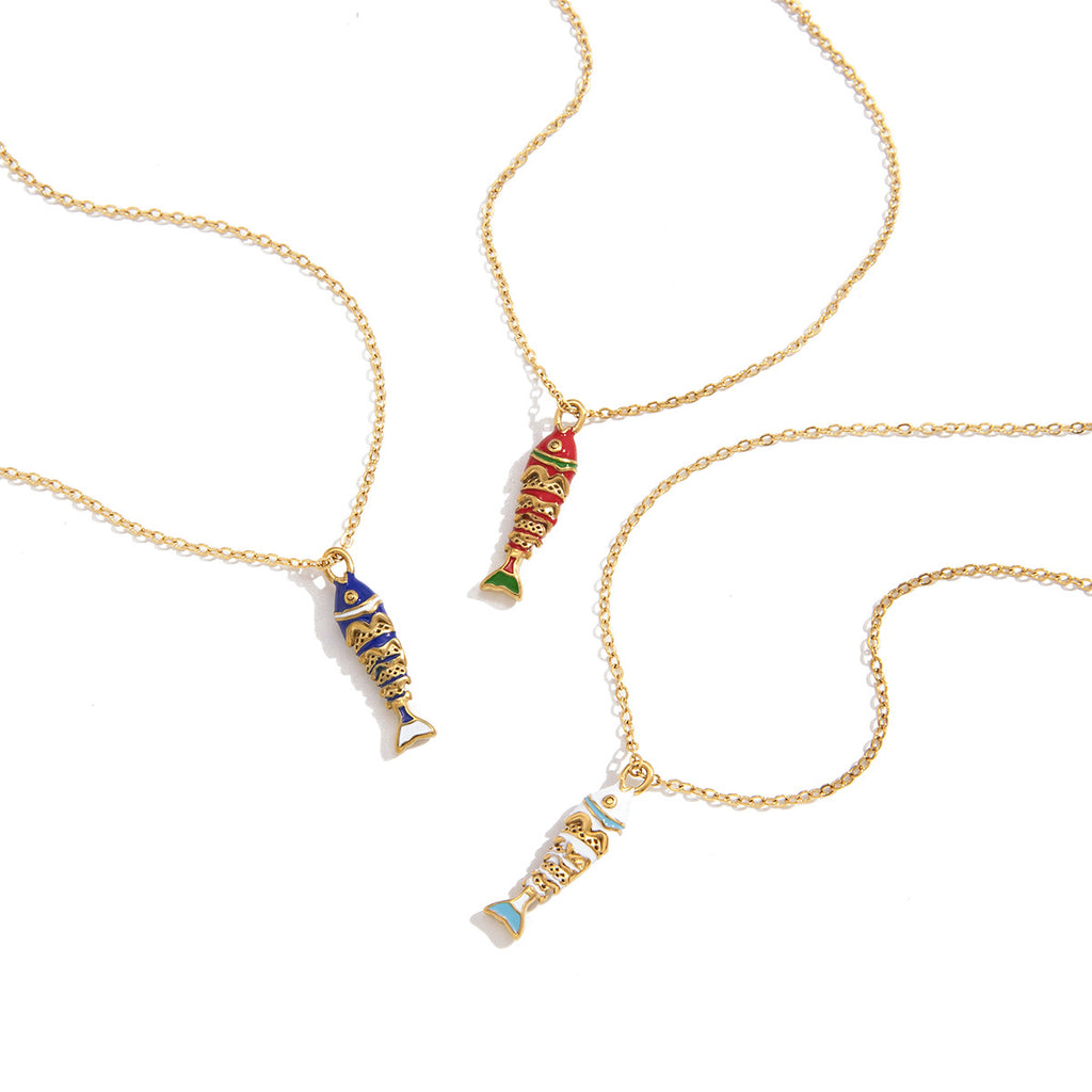Fish pendant necklaces with colored detailing on white