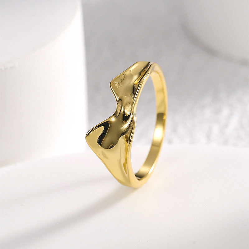 upright molten wave band showing deep polished curves