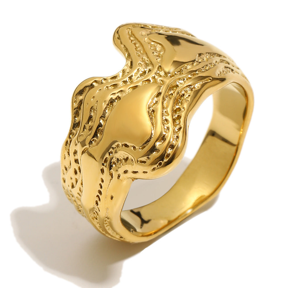 isolated gold plated stainless steel wave statement ring