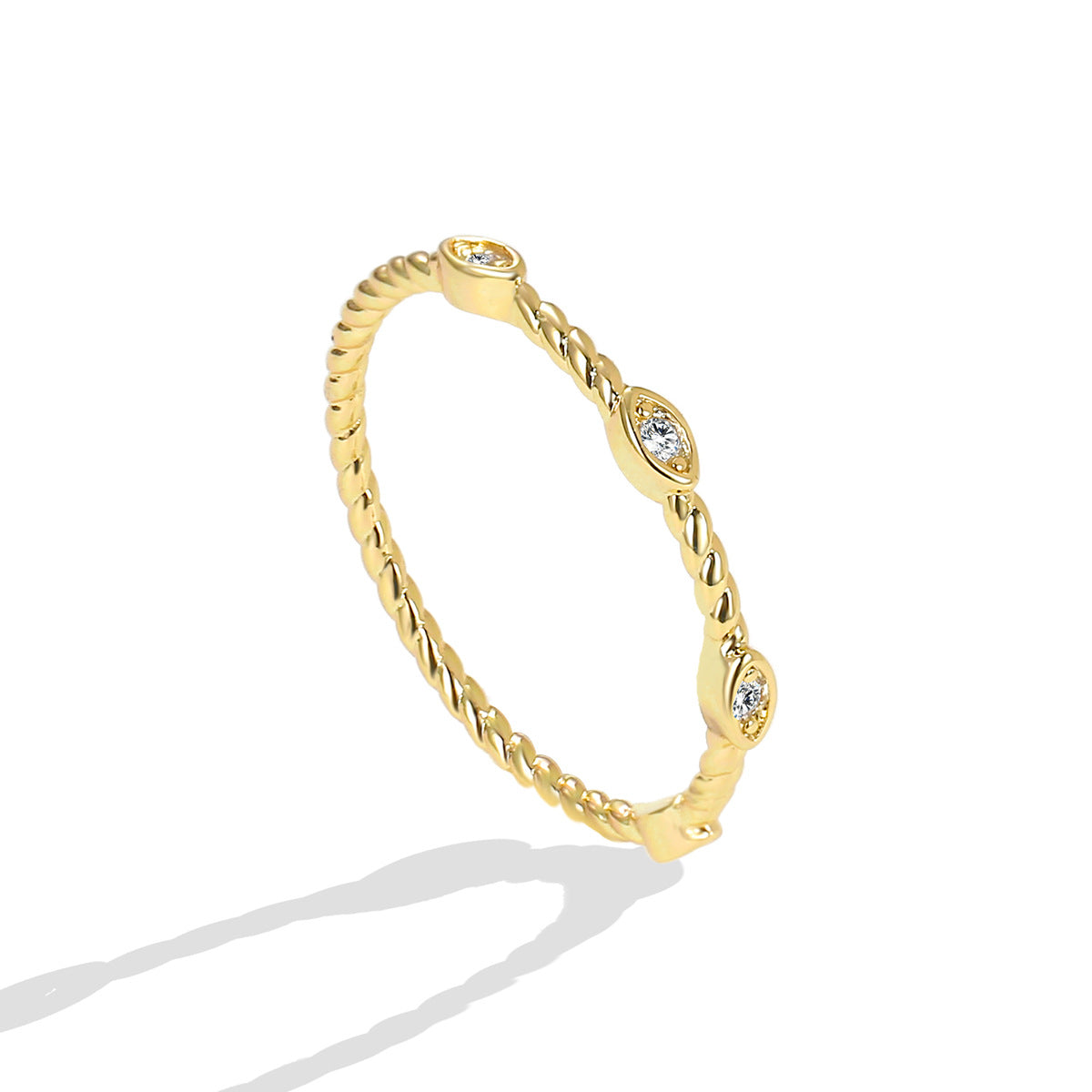 angled product view of three spaced stones on rope-twist ring