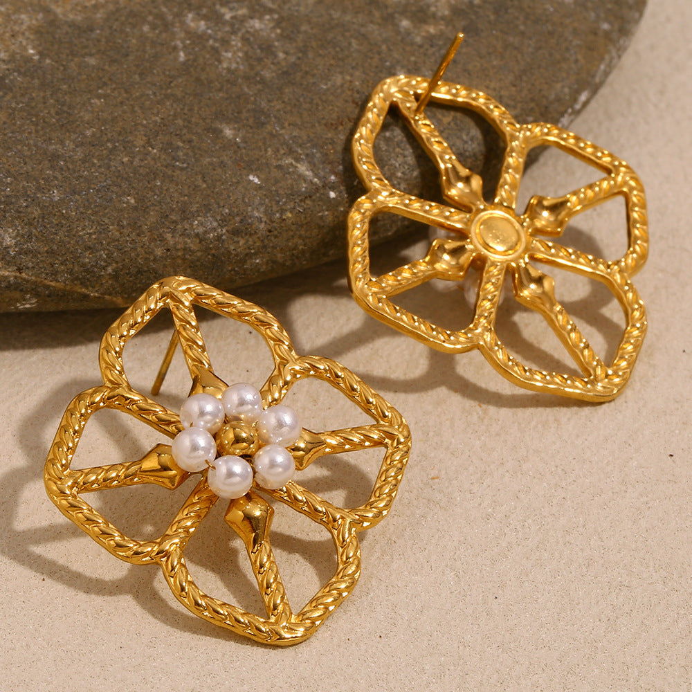 front and back view of textured openwork floral earrings