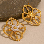 front and back view of textured openwork floral earrings