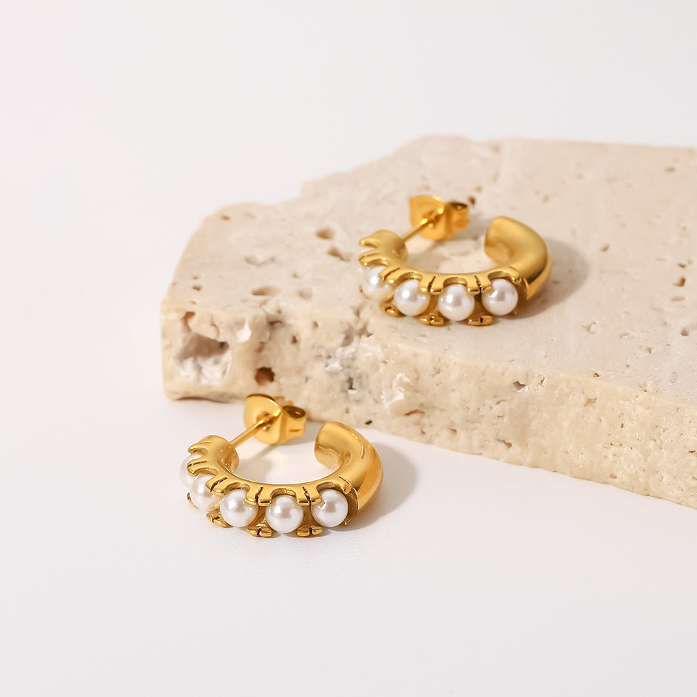 18 and 22 mm pearl-set open hoop earrings on pale stone