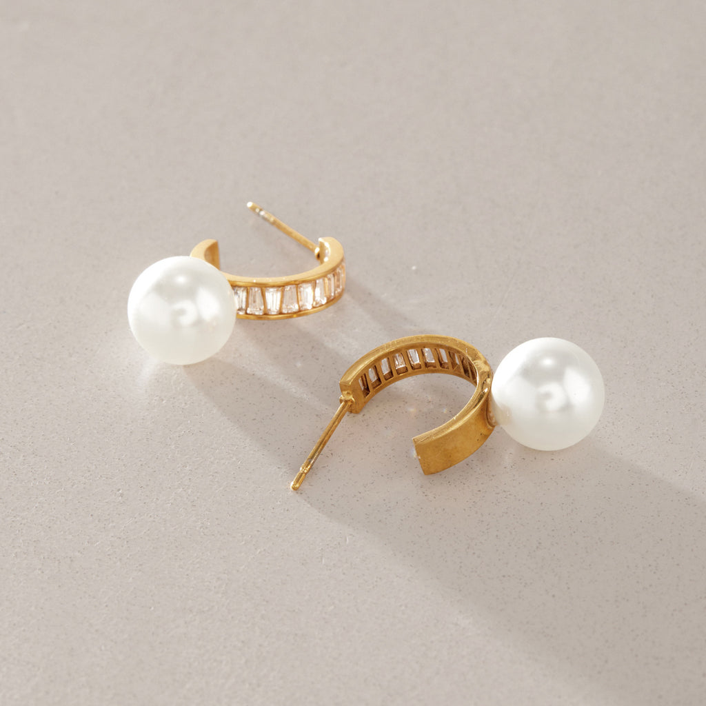 Glass pearl hoops showing their posts and open backs
