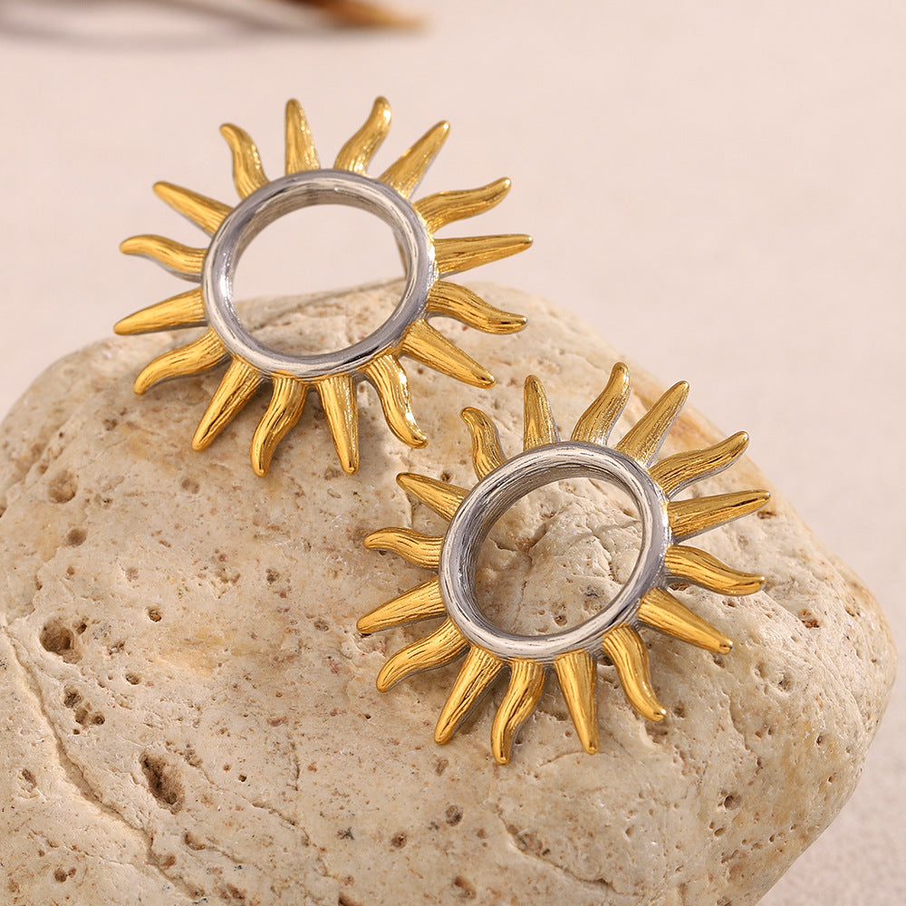 gold plated rays around open silver-finish stud centers