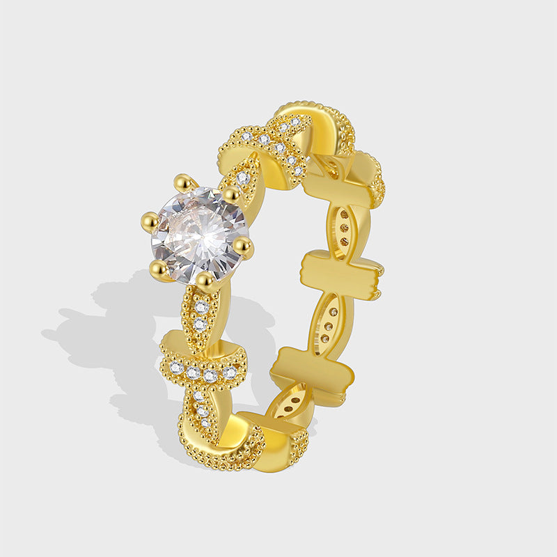 gold plated linked statement ring with round clear zirconia center