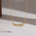 Gold tone round clear stone cluster close-up