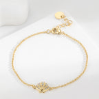 clear stone shell station bracelet arranged on a white display