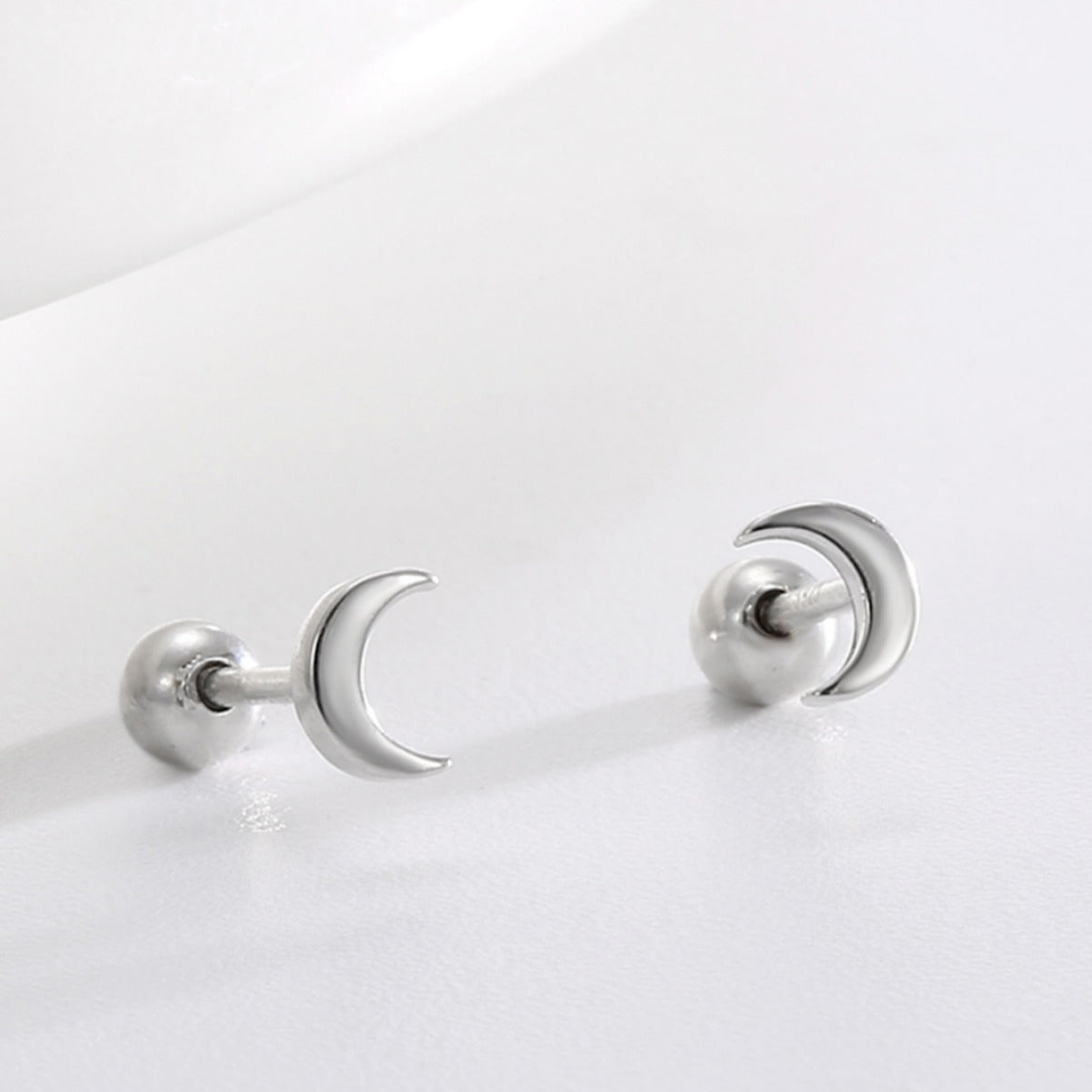 polished crescent moon studs with rounded silver ball backs