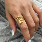 Gold-tone fish skeleton ring worn on a finger