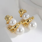 gold plated shell pearl snowman stud earrings close-up