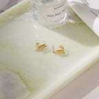 Pair of double marquise earrings displayed on a tray