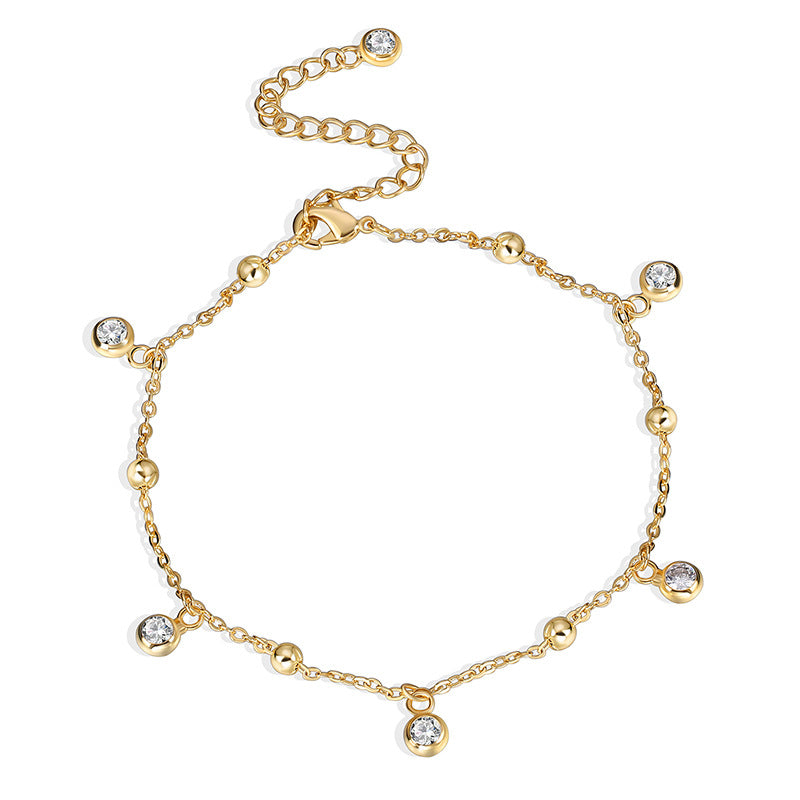 front product view of gold plated zirconia station anklet