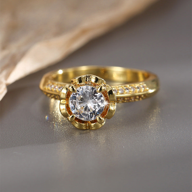 front view of round clear stone in a flower-like prong basket
