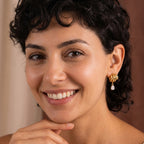 Model wearing short teardrop multi-loop earrings