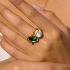 Close-up of green and clear stones on finger