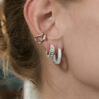 model wearing silver stainless steel square stone huggie earrings
