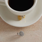 Mesh rings displayed beside a coffee cup