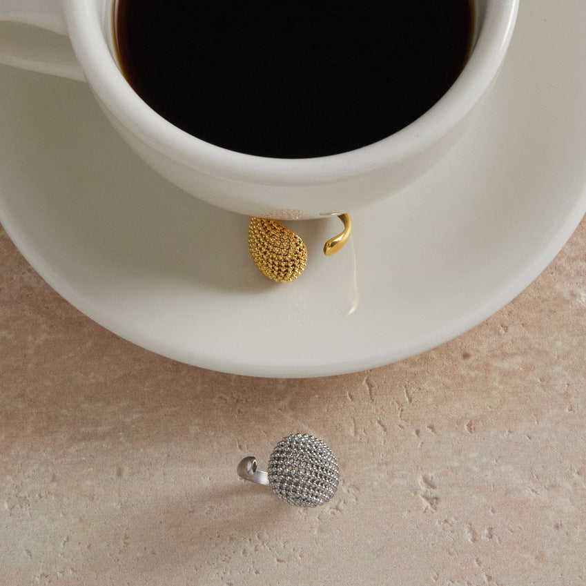 Mesh rings displayed beside a coffee cup