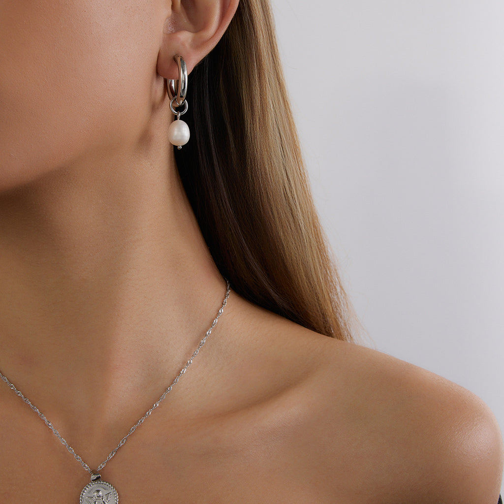 Silver-Finish Pearl-Look Stainless Steel Drop Hoop Earrings – flat-lay view