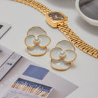 Gold-Tone White Floral Stainless Steel Stud Earrings – flat-lay view