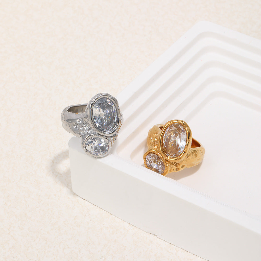 paired two-stone statement rings in gold and silver finishes
