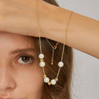 white shell pearl necklace shown with its extension chain