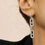 Close view of rhinestone outlined links on an ear