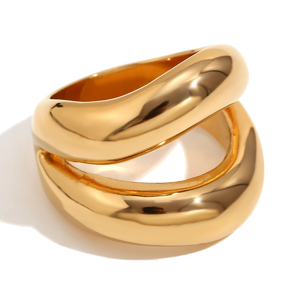 isolated gold plated sculptural triple-band ring