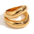 isolated gold plated sculptural triple-band ring