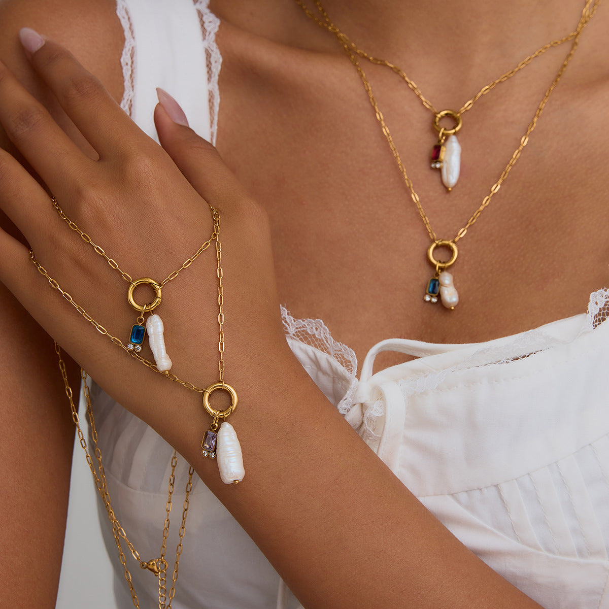 Gold-tone stainless steel pearl drop necklace and ring collection worn view