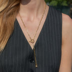 Paperclip lariat worn over a waistcoat