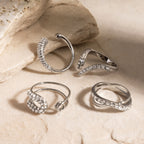 Four silver-tone stainless steel ring styles