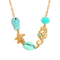 Gold plated fish and shell necklace detail