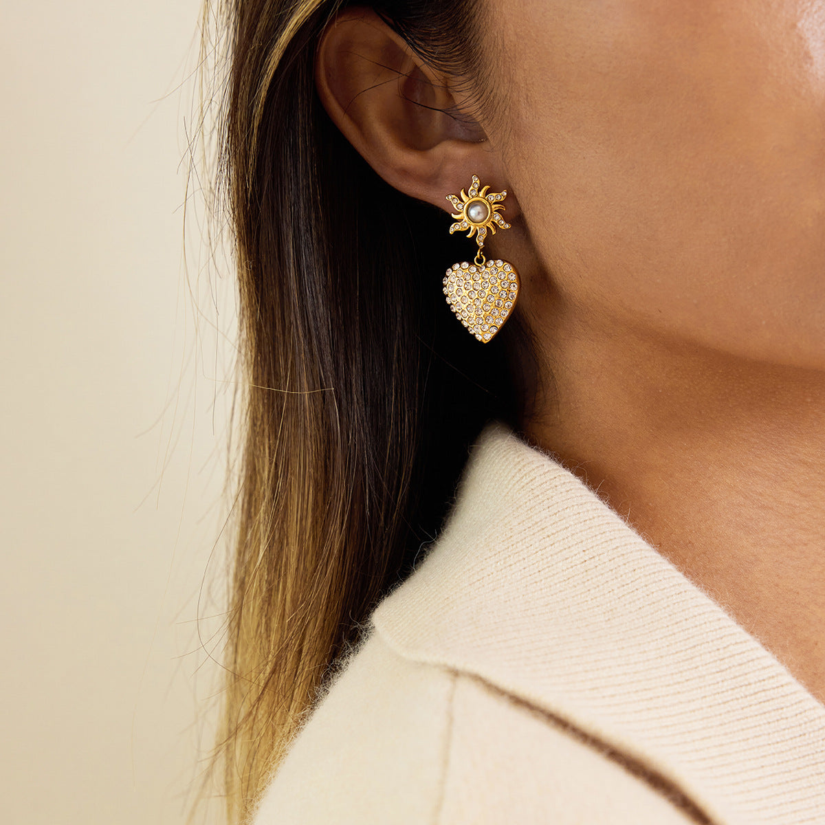 Side view of heart drop earrings with white teardrop bead