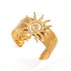 angled product view of raised spiral sun wide cuff bracelet