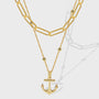 gold plated layered necklace with paperclip chain and anchor pendant