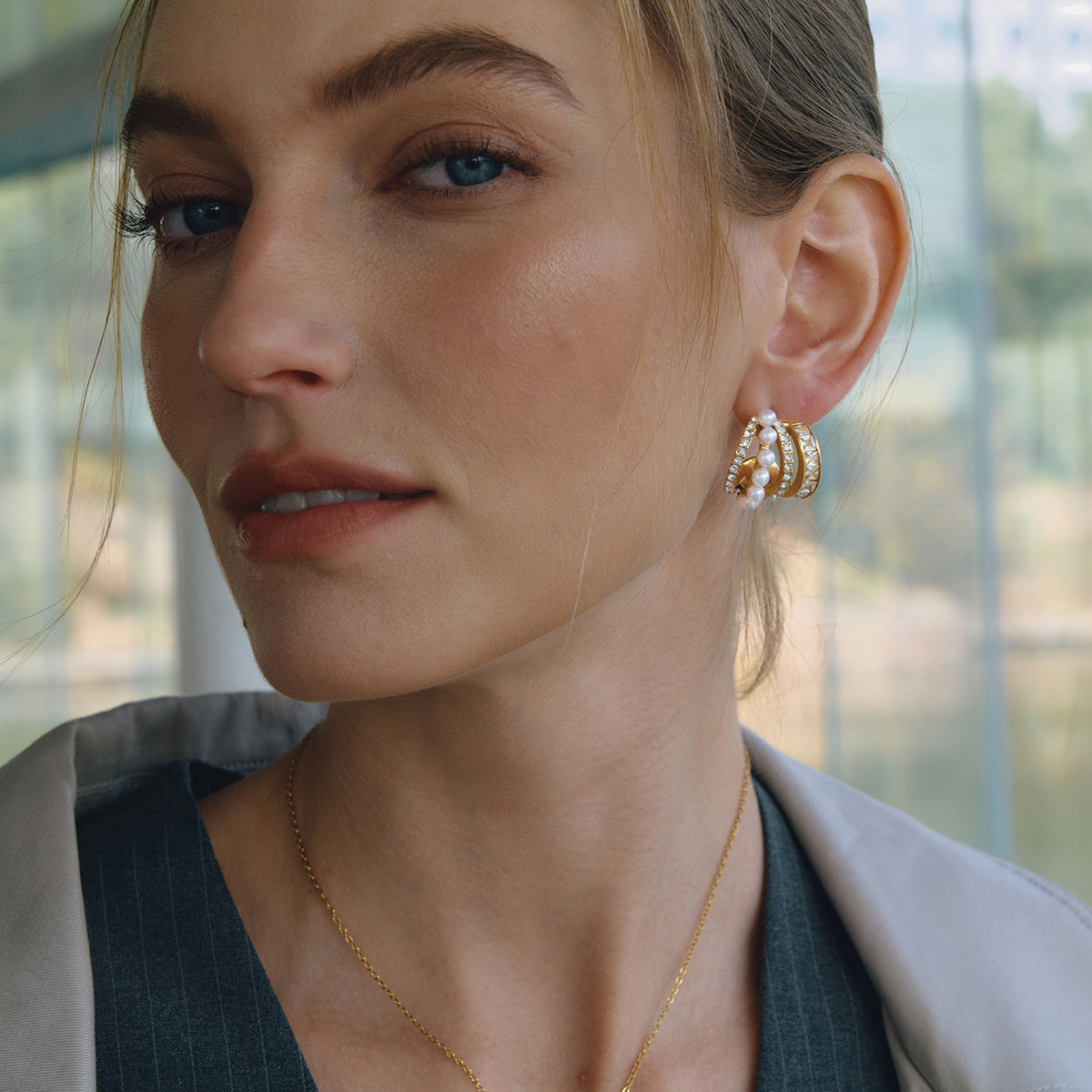 Gold-finish pearl and stone multi-row earrings shown worn