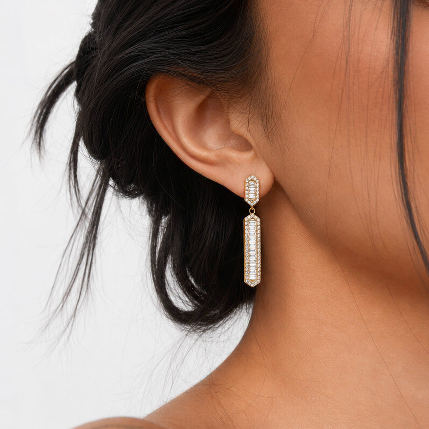 Long bar earring shown in profile on an ear