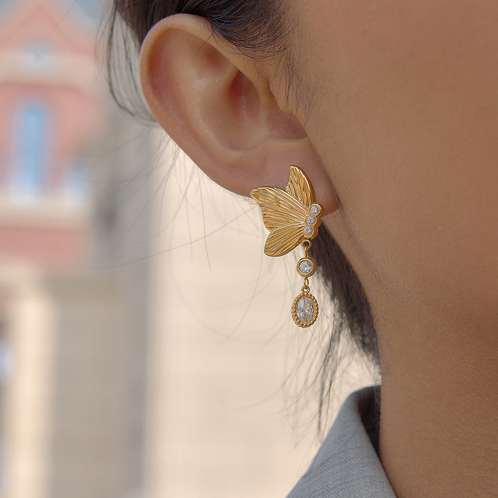butterfly drop earring shown from the side on ear