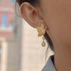 butterfly drop earring shown from the side on ear