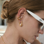 U-shaped hoop styled with other earrings