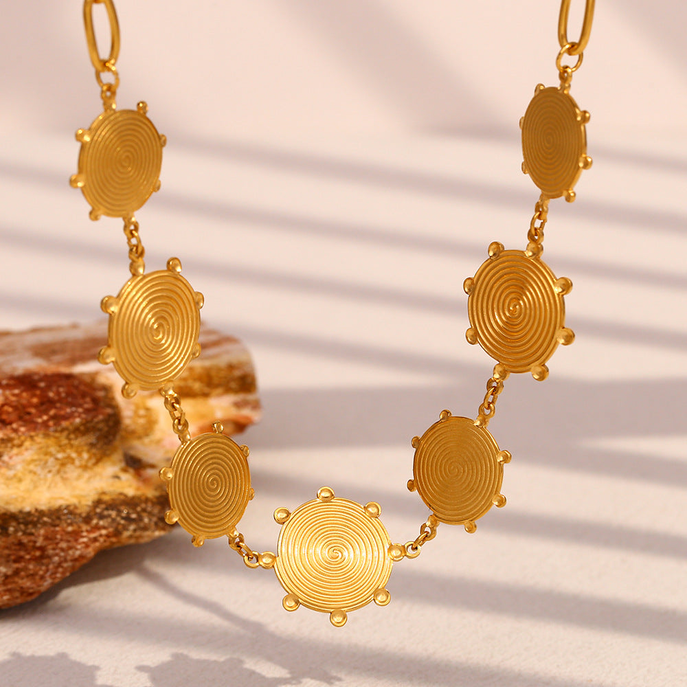 Gold Plated Stainless Steel Spiral Disc Station Necklace — front view