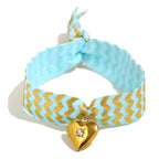 Blue Fabric Tie Bracelet with Gold Plated Stainless Steel Heart Locket — front view